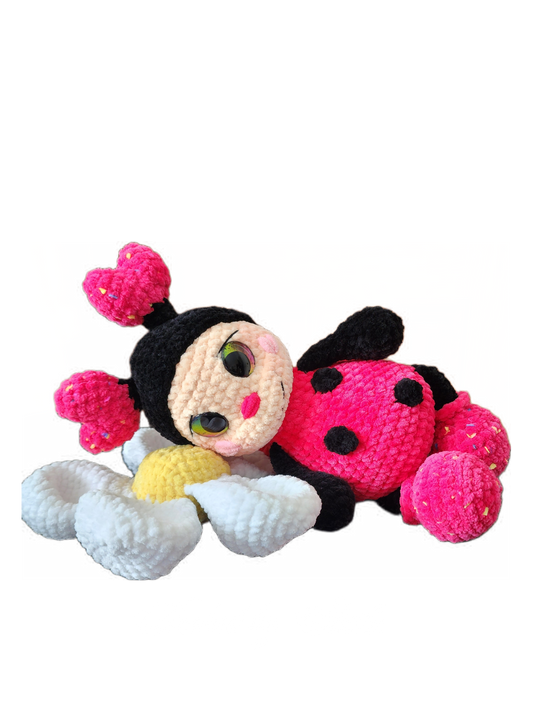 Crocheted ladybug and flower