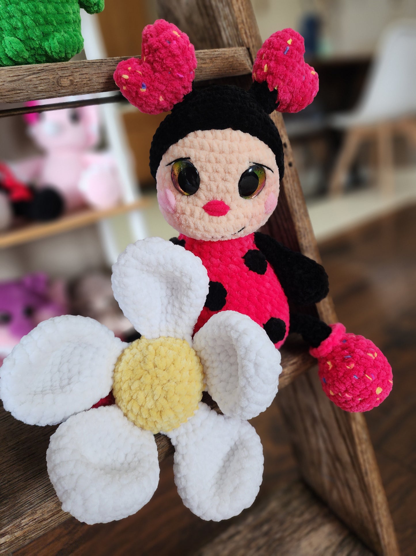 Crocheted ladybug and flower