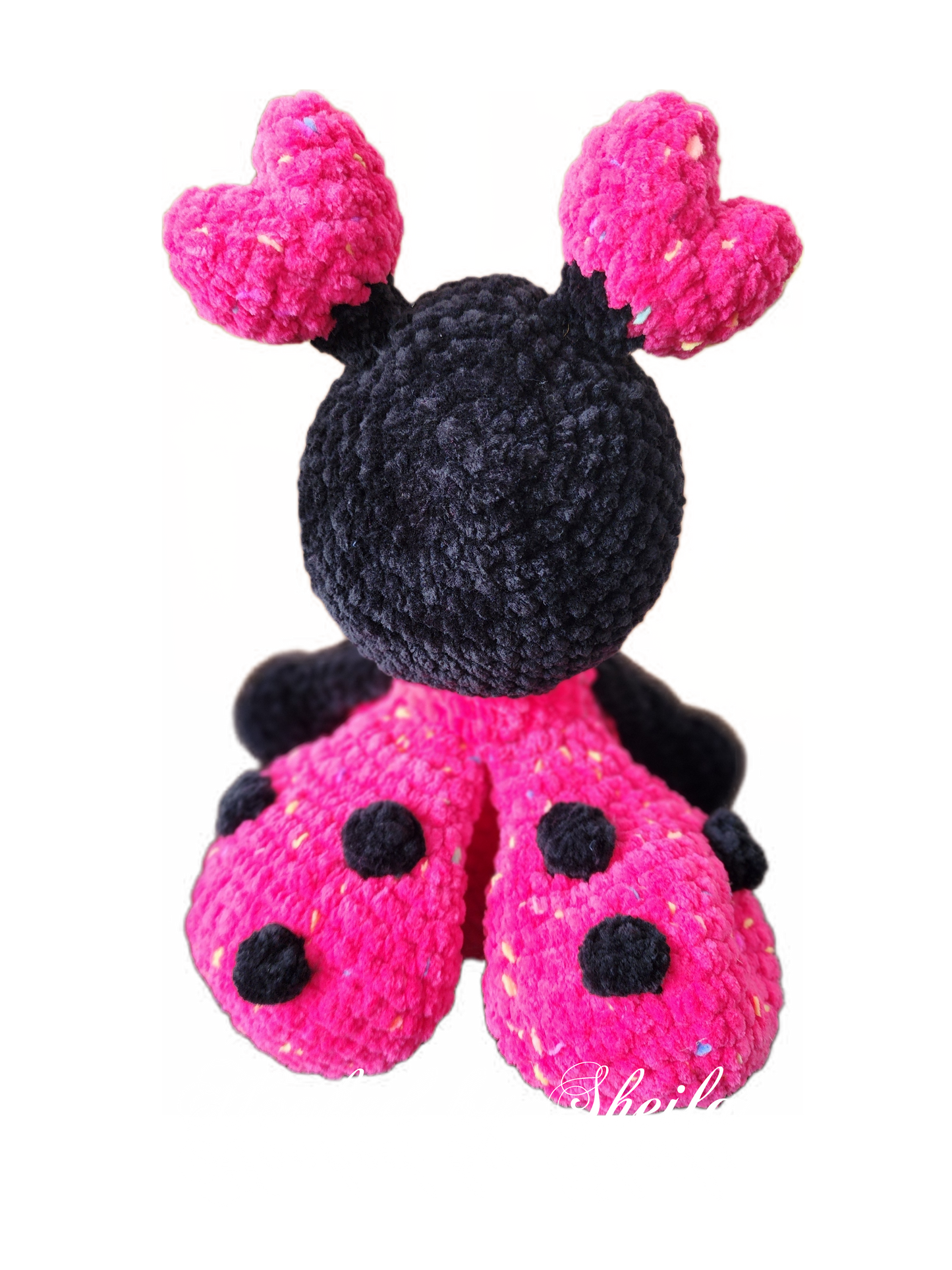 Crocheted ladybug and flower
